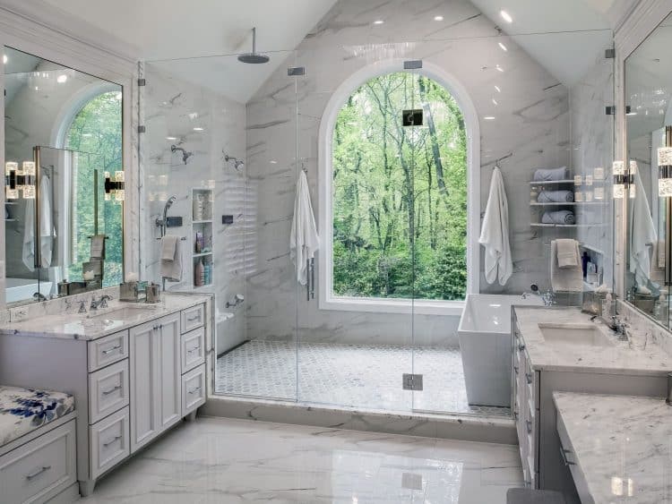 large arched window in master bathroom shower