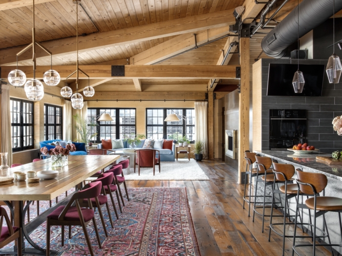 urban loft interior with wood paneled ceiling and wood floors