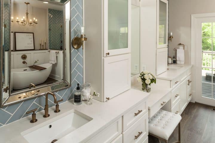 painted white bathroom cabinetry with roomy tower cabinets