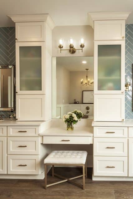 white painted bathroom tower cabinets and vanity