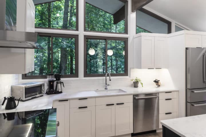 Bright white cabinetry and countertops to reflect light