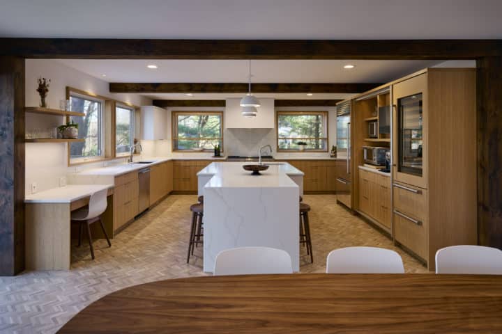 large u-shape kitchen with natural light and adjacent dining area