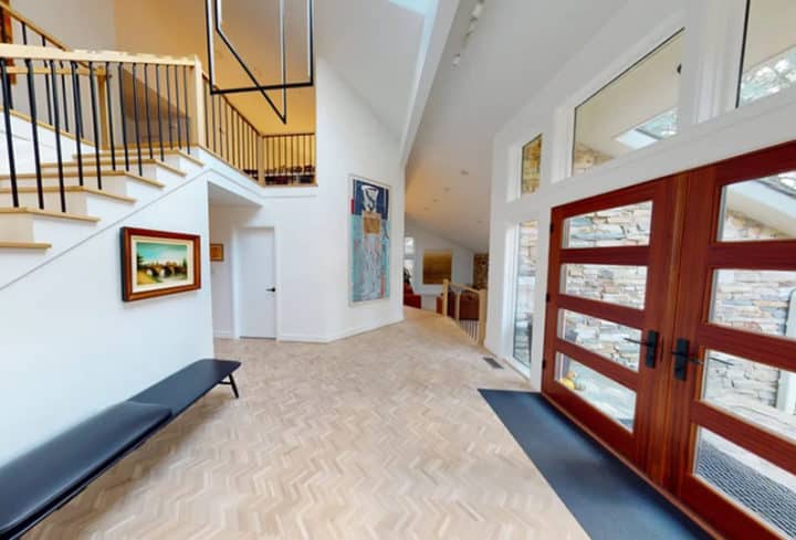 large foyer with wood and glass entry door