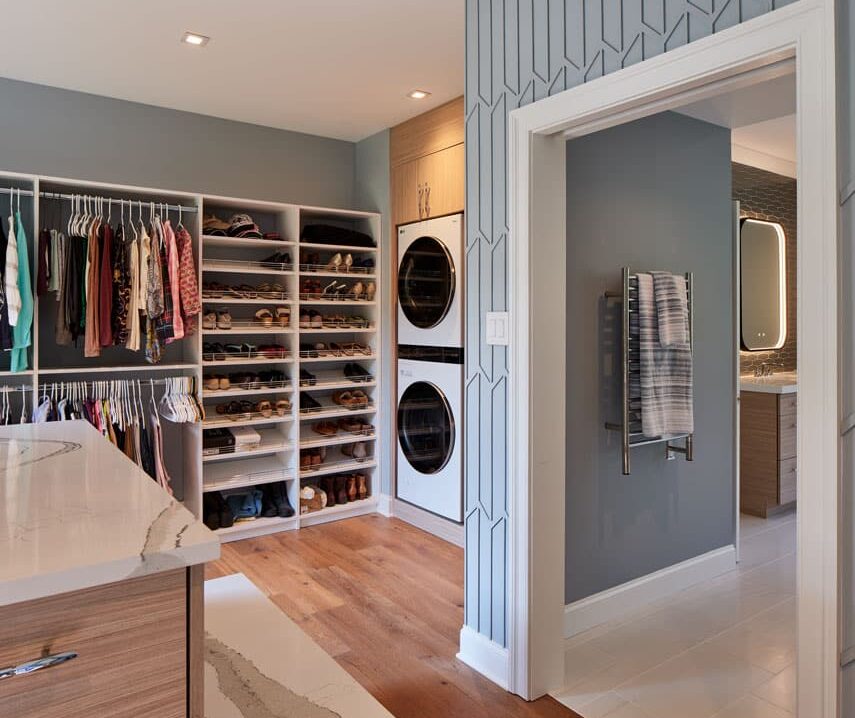 luxurious walk in closet with laundry