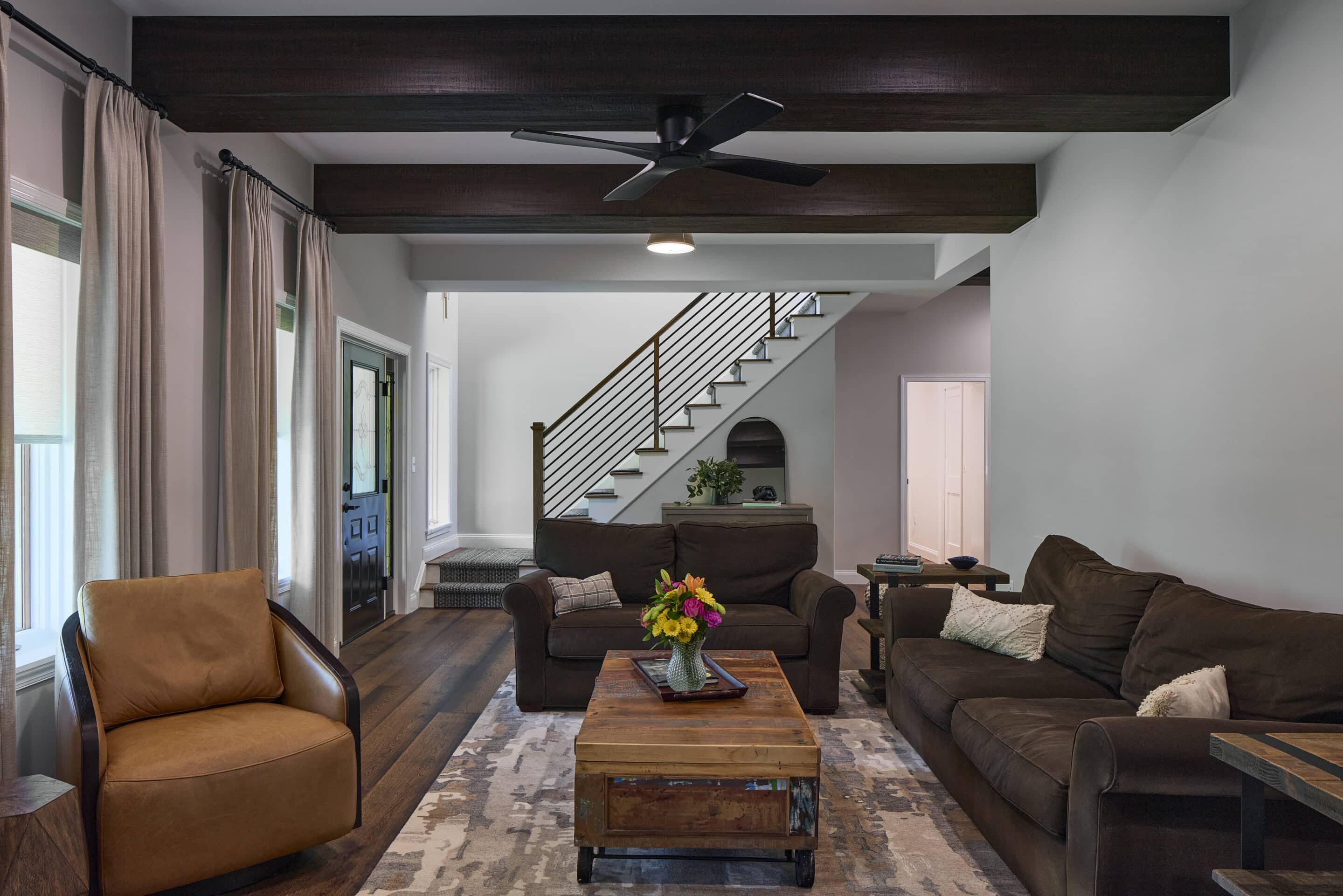 great room with faux wood beams