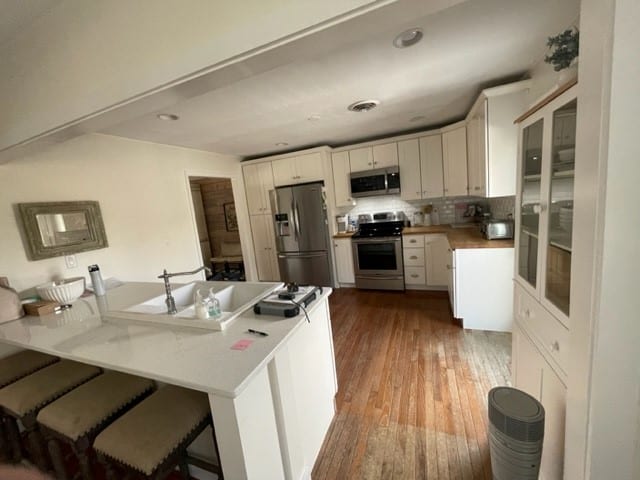 soft gray cabinets kitchen remodel, wood and copper accents, open concept
