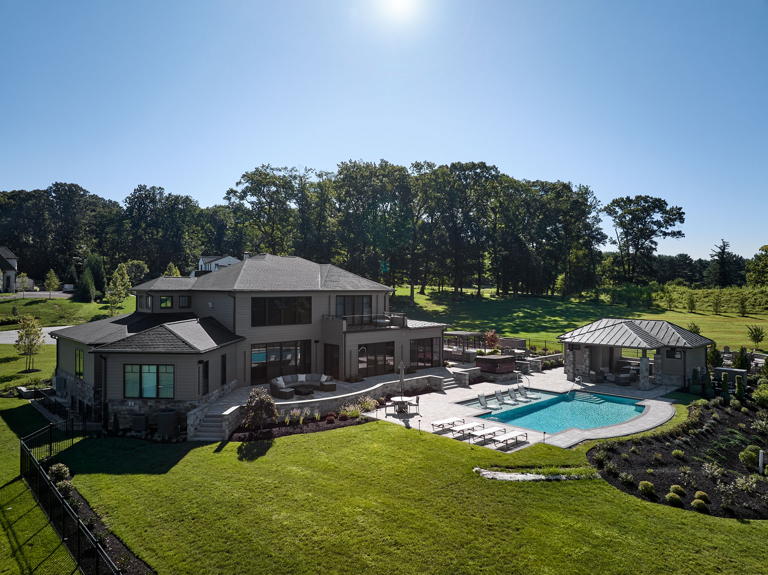 luxury custom home with pool and outdoor living spaces