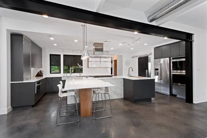 industrial style kitchen, dark gray contemporary cabinetry, black metal beams